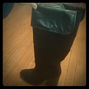 Black heeled knee-high boots